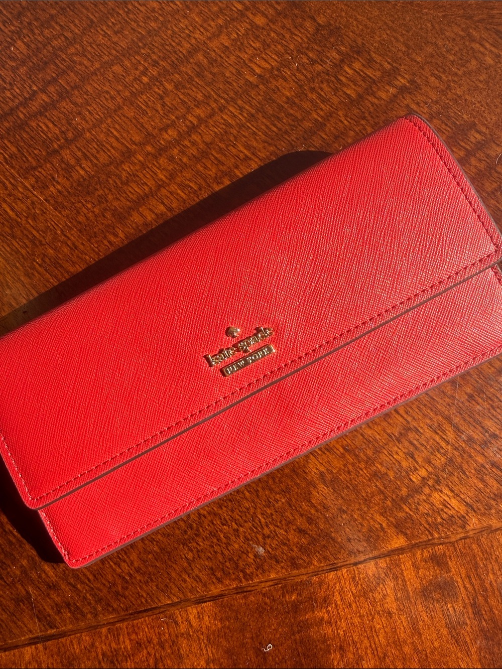 kate spade red saffiano continental wallet with gold logo